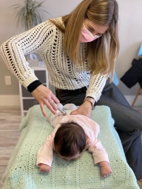 Gentle pediatric chiropractic adjustment for an infant